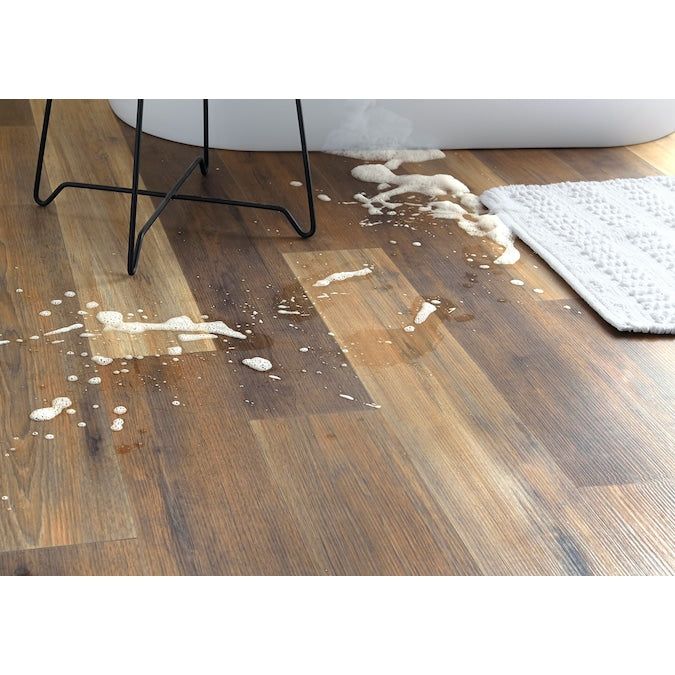 Style Selections Hickory Medley 12-mm T x 6-in W x 50-in L Water Resistant Wood Plank Laminate Flooring (17.07-sq ft / Carton)