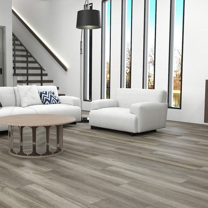 STAINMASTER PetProtect Pheasant Lane Oak 12-mm T x 7-1/2-in W x 50-in L Waterproof Wood Plank Laminate Flooring (23.69-sq ft / Carton)