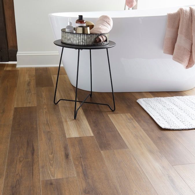 Style Selections Hickory Medley 12-mm T x 6-in W x 50-in L Water Resistant Wood Plank Laminate Flooring (17.07-sq ft / Carton)