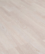 allen + roth European white oak Frosty is an Oak wood floor with brown, a wire brushed texture, and a low-gloss finish that highlights the wood’s natural variation hardwood flooring — primary plank view