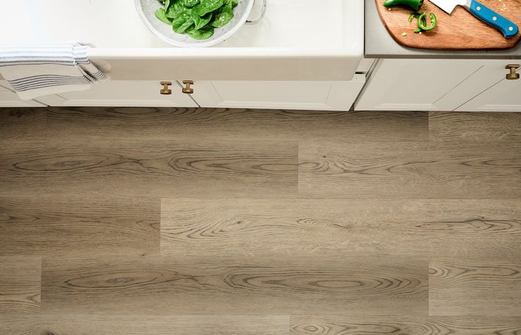 STAINMASTER London Sky Oak 6-mm x 7-in W x 48-in L Waterproof Interlocking Luxury Vinyl Plank Flooring (19.22-sq ft/case)
