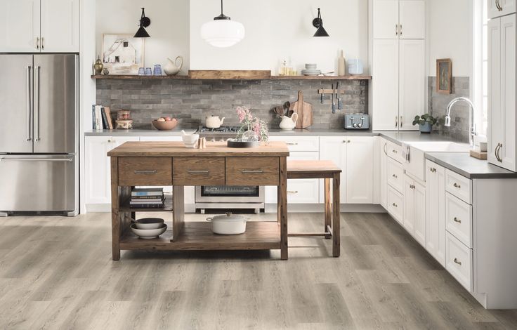 STAINMASTER London Sky Oak 6-mm x 7-in W x 48-in L Waterproof Interlocking Luxury Vinyl Plank Flooring (19.22-sq ft/case)