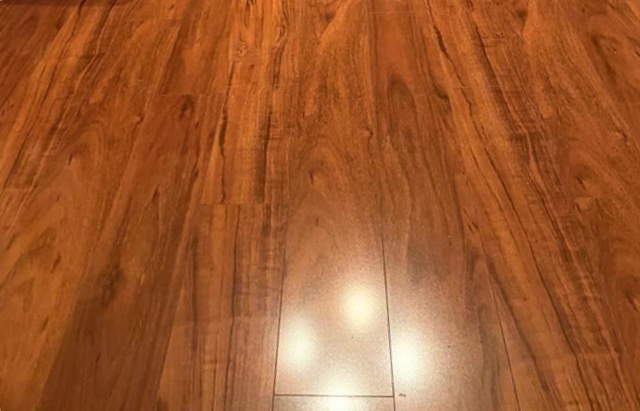 TrafficMaster Jatoba 8 mm T x 5.6 in. W Laminate Wood Flooring (18.7 sqft/case)