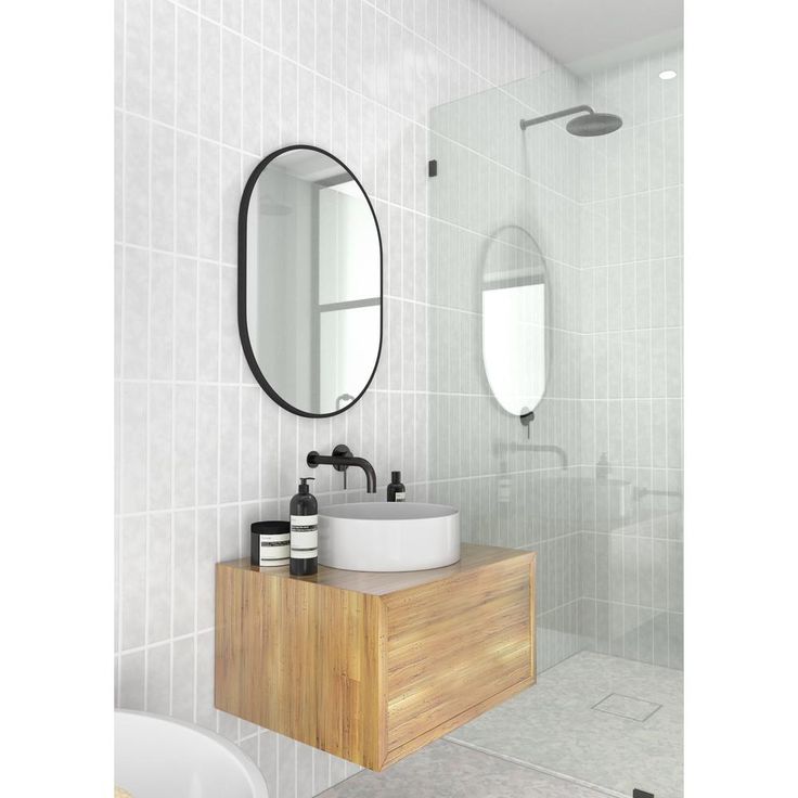 28 in. x 20 in. Pill Shape Black Stainless Steel Framed Mirror