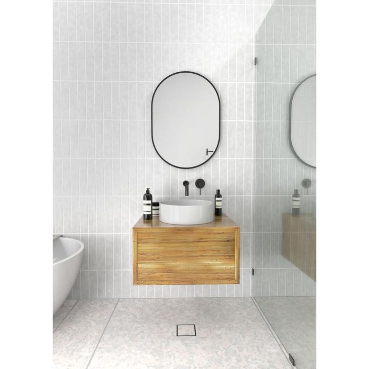 28 in. x 20 in. Pill Shape Black Stainless Steel Framed Mirror