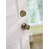 Kwikset Tylo Antique Brass Entry Door Knob and Single Cylinder Deadbolt Combo Pack with Microban Antimicrobial Technology