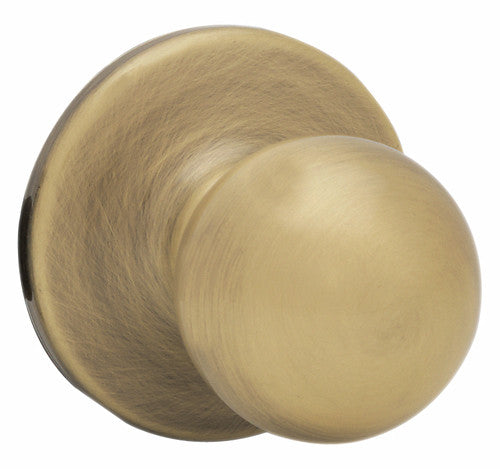 Kwikset Polo Antique Brass Passage Door Knob, Right or Left Handed