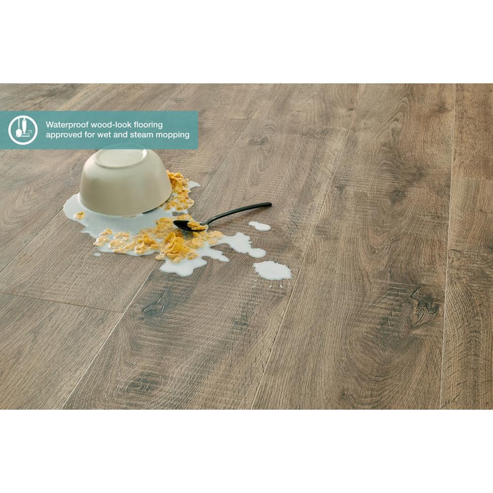 Pergo Defense+ Tanned Chester Oak 14 mm T x 7.4 in. W Waterproof Laminate Wood Flooring (17.18 sqft/case)